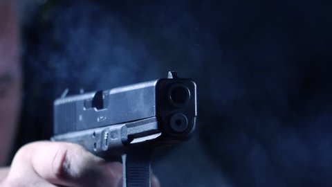 NOVOSIBIRSK, RUSSIA  NOVEMBER 18, 2017: GLOCK 17 pistol shoots in slow motion