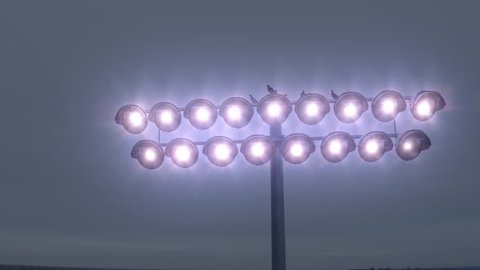 4k Stadium Lights turning On, Aerial fly around 库存视频