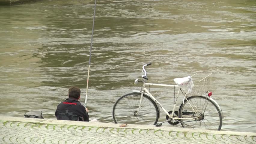 Man is fishing near river in Skopje