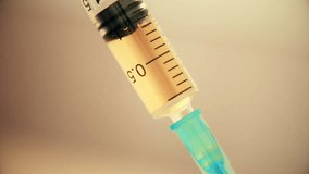Close-up of syringe during injection drugs or medecine. 4K UltraHD video