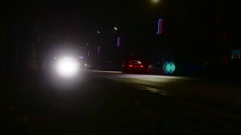 Night traffic city cars, headlight lights.