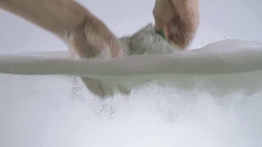 Slow Motion Of Hands Washing A Glass Using Detergent And Sponge