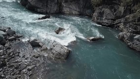 Aerial 4k drone footage of a beautiful river flowing in the canyon by the Sea to Sky Highway. Taken in Cheakamus between Whistler and Squamish, North of Vancouver, British Columbia, Canada.