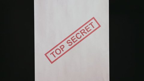 Top secret document. Burning a top secret paper document