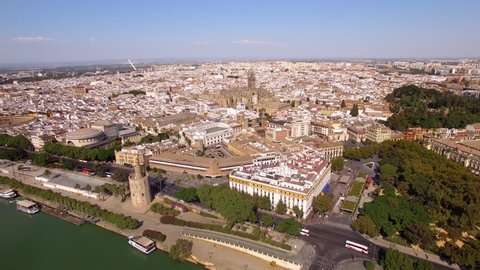 Aerial view of Seville city including the Cathedral and Torre del Oro in Sevilla, Andalusia, Spain.