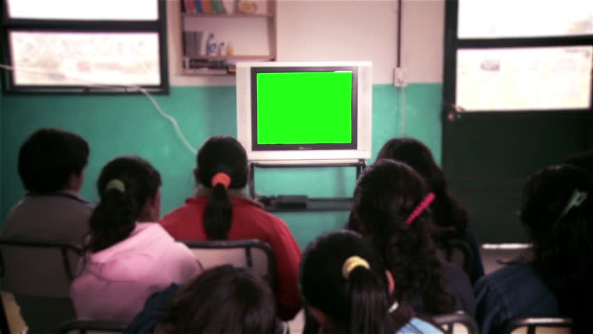 School Children Watching TV Green Screen in Classroom. You Can Replace Green Screen with the Footage or Picture you Want with “Keying” effect in After Effects  (check out tutorials on YouTube). Royalty-Free Stock Footage #33020071