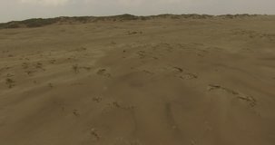 Aerial drone video over Sand Dunes on a desert island