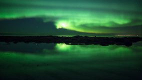 Bright aurora borealis mirror reflection in calm ocean water tidal pool Iceland
 - Powered by Shutterstock - Get 15% off with code: PIKWIZARD15