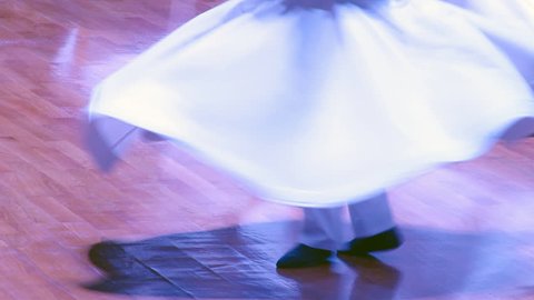 TURKEY-KONYA - JUNE 29, 2017: Sufi whirling dervish (Semazen) dances at konya during holy month of Ramadan.Semazen conveys God's spiritual gift to those are witnessing ritual.He spins with the music.