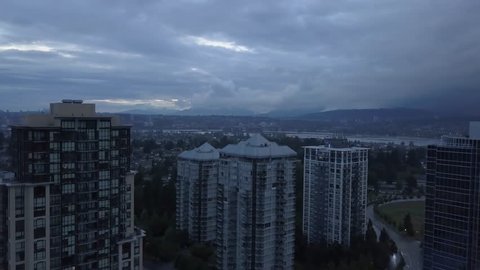 Aerial view of the residential neighborhood during a gloomy and rainy evening. Taken in Surrey, Greater Vancouver, British Columbia, Canada.