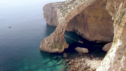 Blue grotto in Malta, aerial view of the arch with green water.
