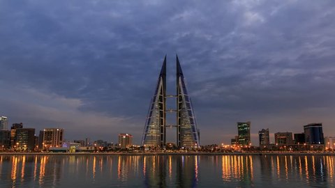MANAMA , BAHRAIN - NOVEMBER 21, 2017: Time lapse of Bahrain Skyline with dark clouds and Bahrain World Trade Center from Manama City, Bahrain