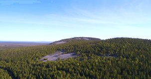 Fjeld mountain, Cinema 4k aerial view towards a tunturi, in the arctic taiga wilderess of Lapland, in Lappi, Finland.