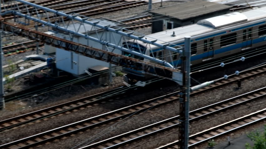 TOKYO, JAPAN - NOVEMBER 17TH, 2017. Japan Railway train moving on is track at Tokyo Station. Establishing shot. | Shutterstock HD Video #33040819