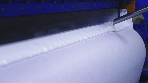 production linoleum. application of PVC-layer on the linoleum