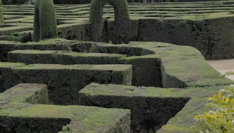 Slow camera pan over a labyrinth garden