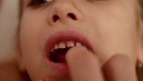 Mother works on a free tooth from her daughter - Powered by Shutterstock - Get 15% off with code: PIKWIZARD15