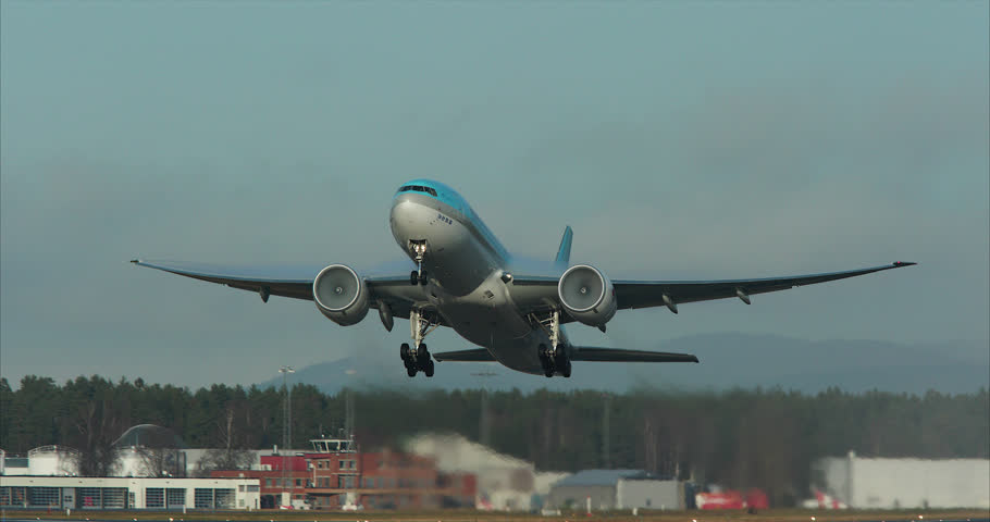 OSLO AIRPORT NORWAY - CA NOVEMBER 2017: huge boeing 777 take off from runway beautiful evening sun
