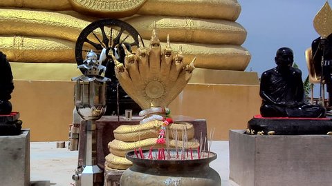 Golden Buddha besides the Big Buddha Statue at Wat Phrathong