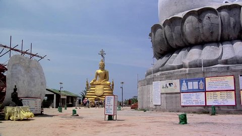 Golden Buddha besides the Big Buddha Statue at Wat Phrathong