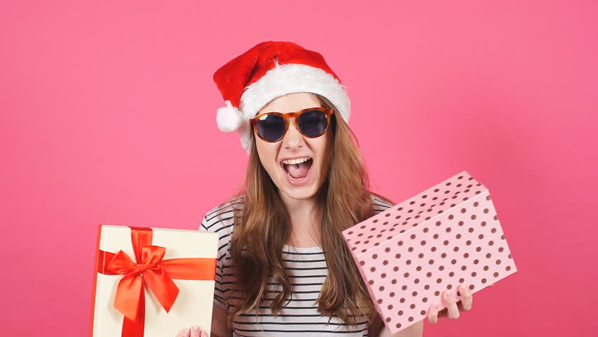 Attractive girl hold gift box in hands and showing different emotions. Slow motion. | Shutterstock HD Video #33080530