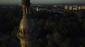 Tower of the Plaza de Espana and the city of Seville (Sevilla) at sunrise.  4k aerial drone footage.  