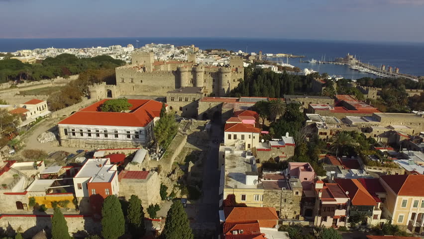 Rhodes town, Greece, from above, captured by drone. Beautiful architectural ensemble of medieval clock tower, Suleiman mosque and Rhodes castle