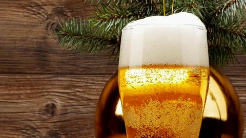 Beer is poured near the Cristmas tree