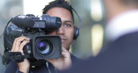 Cameraman filming for media broadcasting