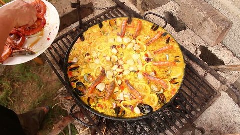 Seafood paella in the fry pan, typical Spanish dish (paella de marisco)