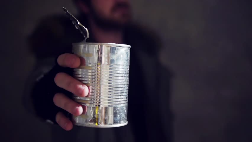 homeless man hold out a tin
