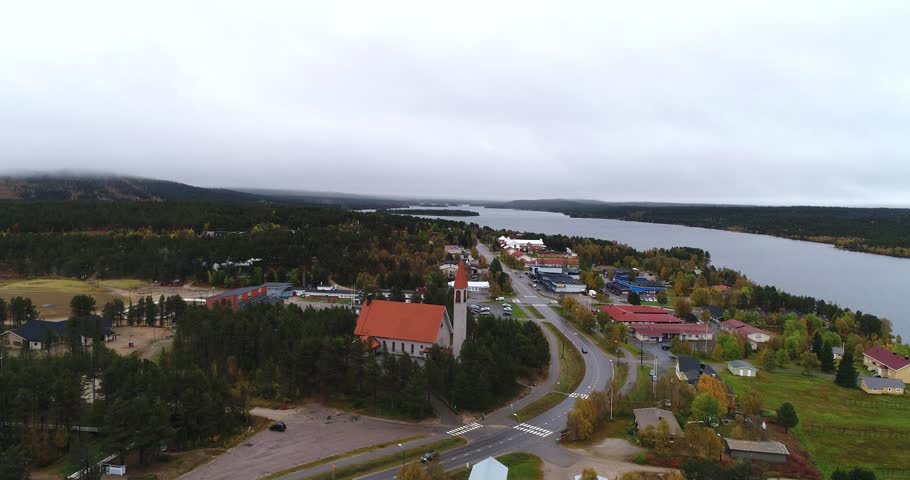 Lapland church, Cinema 4k aerial view towards a church, in hetta town, on a cloudy and foggy autumn day, in Lappi, Finland