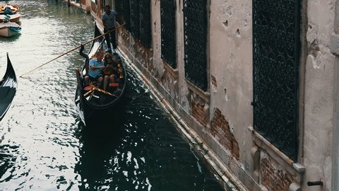 Beautiful gondolas sail through the Venetian canals and old streets