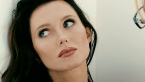 Make-up artist applying make-up on model's face - close-up 4k video