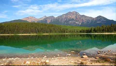 Mountain lake with reflection on the smooth water. (Patricia lake and Pyramid Mountain) in Jasper National Park, Canada 
