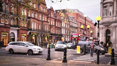 LONDON- NOVEMBER, 2017: Timelapse of Sloane Square and Sloane Street in Knightsbridge/Chelsea showing traffic and shoppers crossing the road