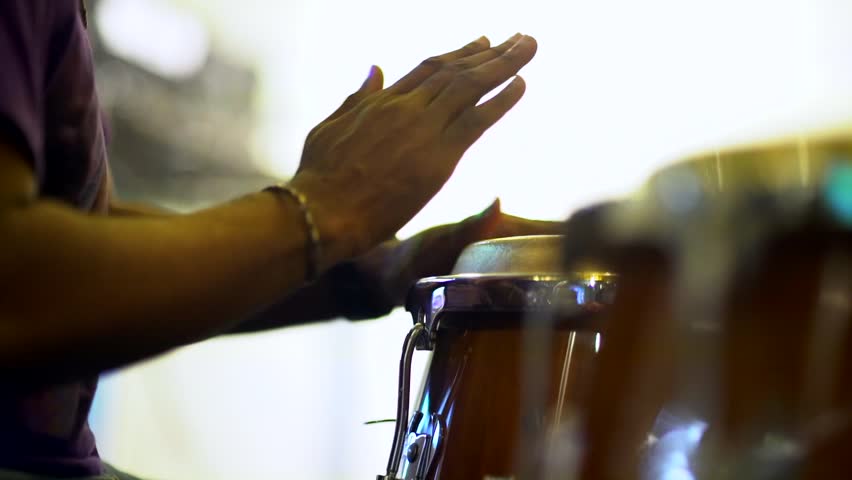 Close up unrecognizable musician is playing congas with music stand. Royalty-Free Stock Footage #33135835