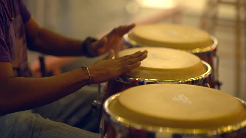 Close up unrecognizable musician is playing congas with music stand. Royalty-Free Stock Footage #33135853