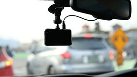 video camera recorder in car driving on road