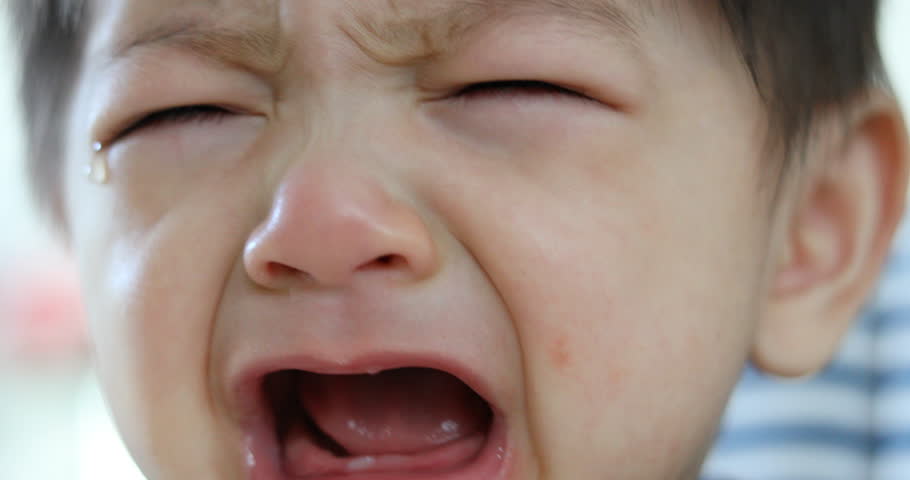 baby crying with tears