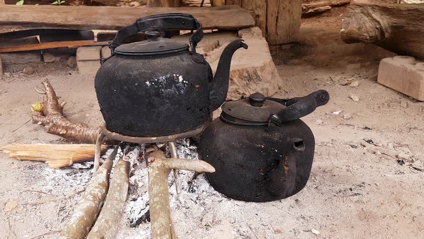 Old kettle put in fire place outdoor for boiling water
