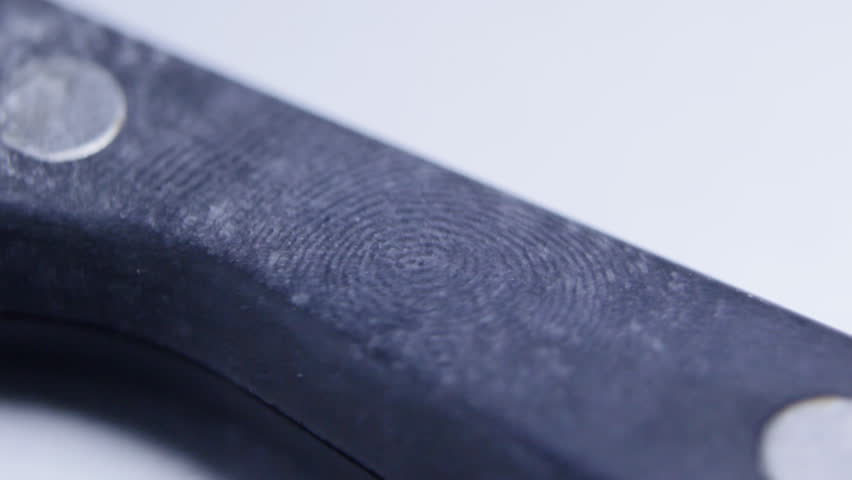 Fingerprints under magnifying glass CU