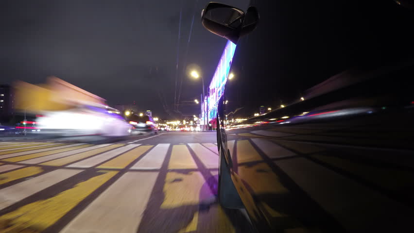 Fast city drive night road POV through city at night timelapse left side of car. Low angle view. | Shutterstock HD Video #33152773