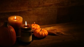 This is a close-up video symbolizing Thanksgiving, fall, autumn, using a still life setting inside a barn background made up of old red wood.There's a lot of space for a copy In this video. 