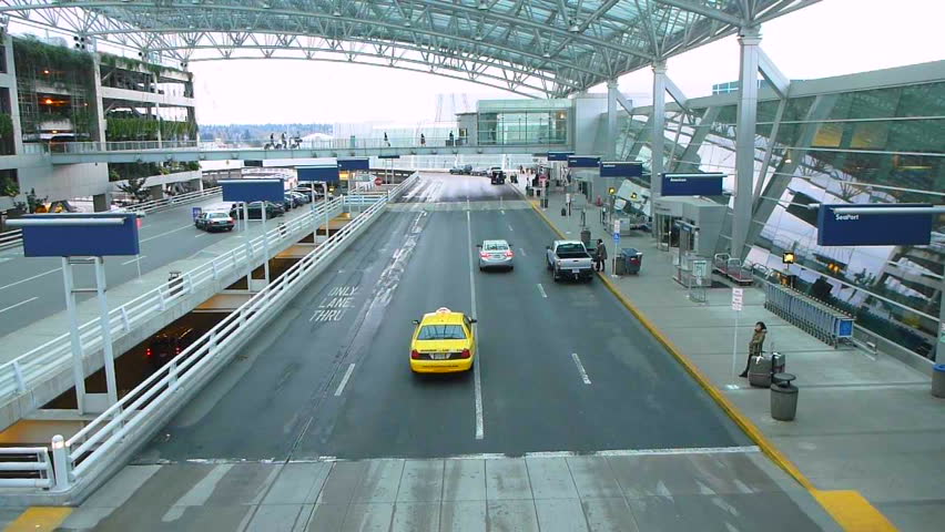 PORTLAND, OREGON AIRPORT - CIRCA 2013:  driving and people traveling with