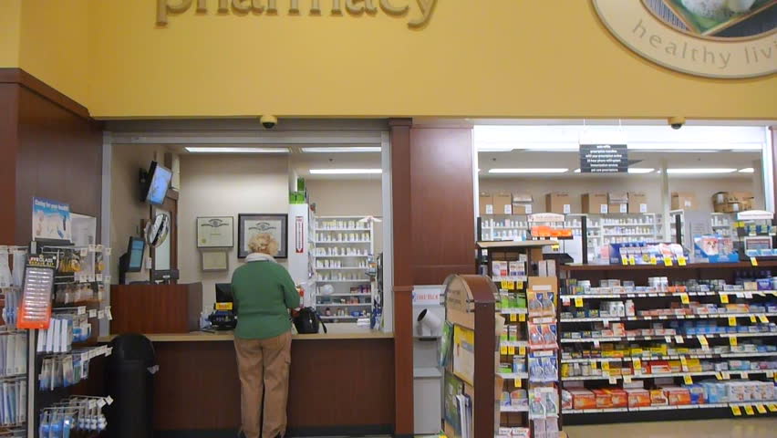 PORTLAND, OREGON  - CIRCA 2013: Elderly woman waiting for prescription from