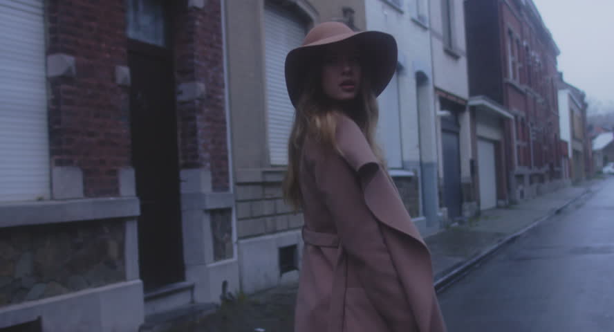 TRACKING SHOT Beautiful Caucasian female in stylish outfit walking in the streets of old European city, urban background. 4K UHD 60 FPS SLO MO | Shutterstock HD Video #33164179