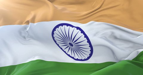 Flag of India waving at wind in slow in blue sky, loop