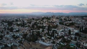4k aerial drone footage - City of Granada Spain at sunset, mountains on the horizon,