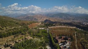 4k aerial drone footage - Mountainous countryside and farms near Granada, Spain.  